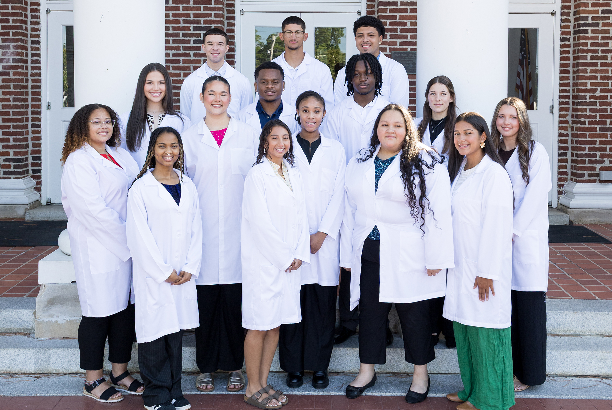 2026 CHSP Cohorts on the steps in front of Old Main on the UNCP campus