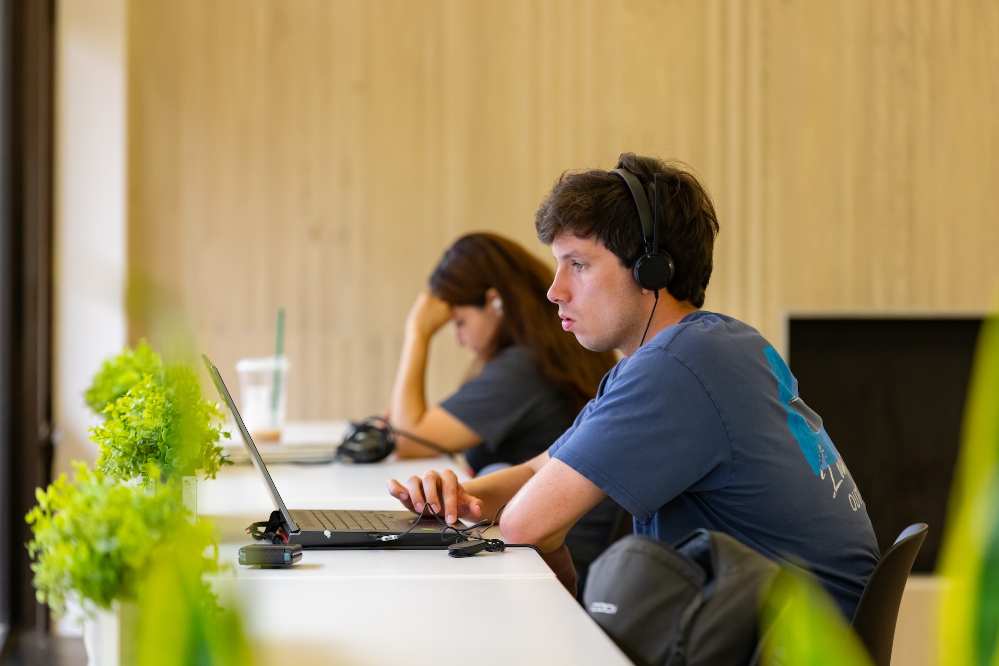 male UNC Pembroke student on laptop