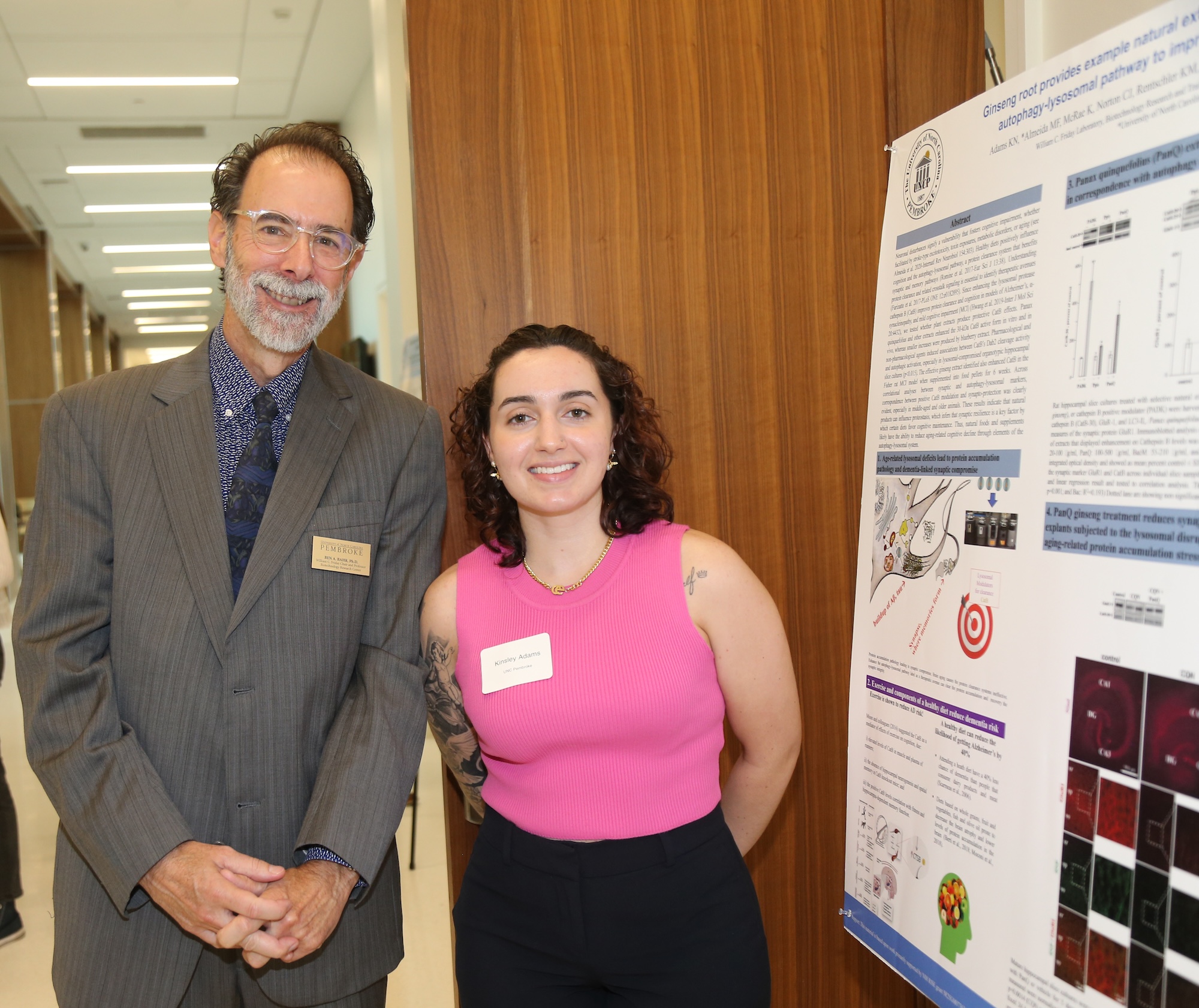 SLAM DUNC Alzheimers Symposium Ben Bahr and student with research poster