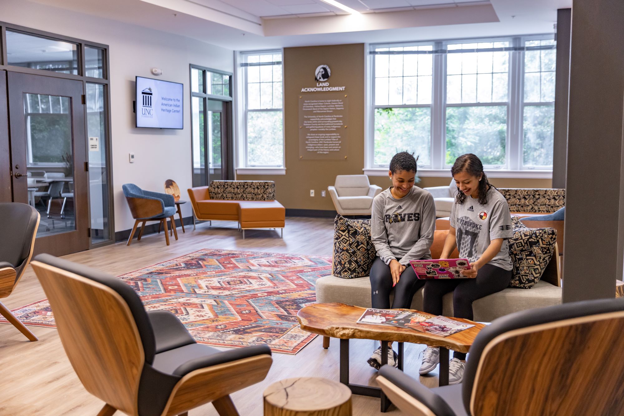 UNCP students gather in the American Indian Heritage Center, representing the cultural community space available to AIS students.