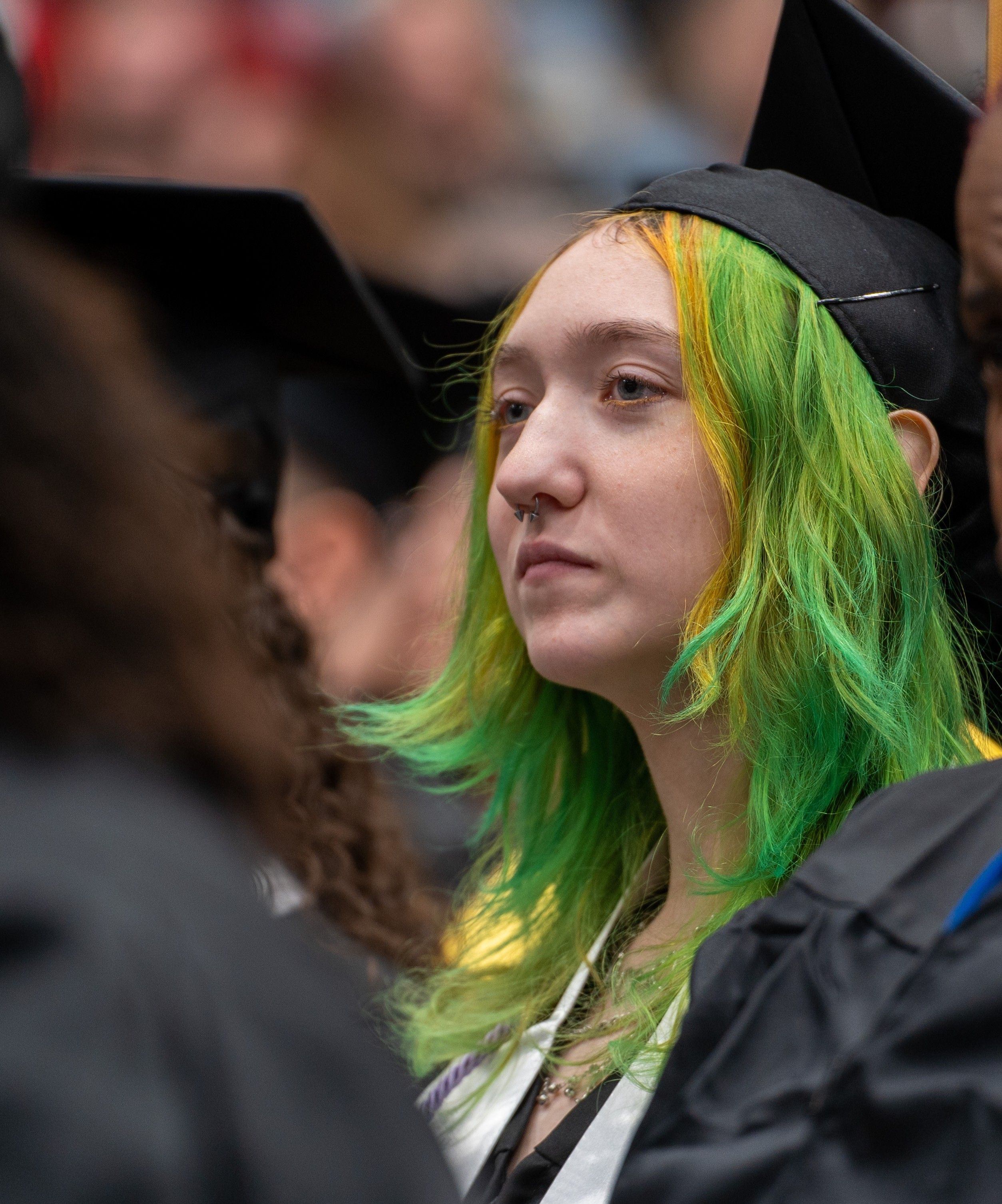 Art student, Bethani Paul, in her cap an gown at winter commencement. Art student in her cap an gown at winter commencement.