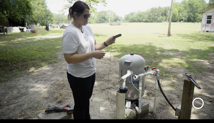 UNCP student Ashley Cashwell Barez running a water test.