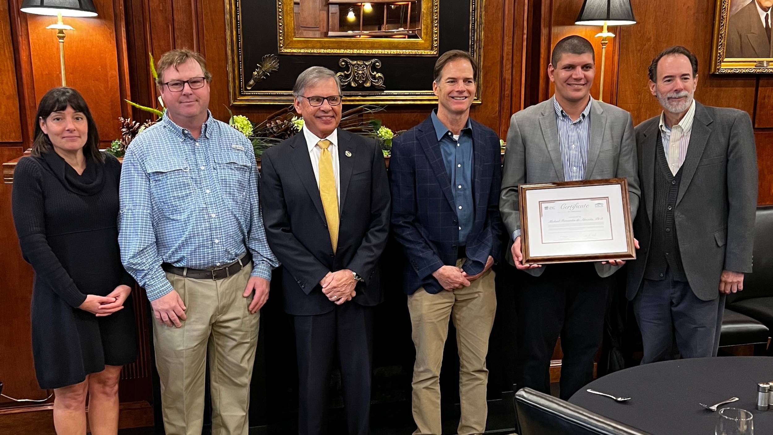 Dr. Stephanie Kamel associate professor UNC Wilmington (far left), Dr. Thomas Williamson Yousry Sayed Distinguished Professor in Pharmaceutical Sciences, UNCW, UNCP Chancellor Robin Gary Cummings, Dr. Stephen Kinsey, UNCW professor, Dr. Michael Almeida and Dr. Ben Bahr