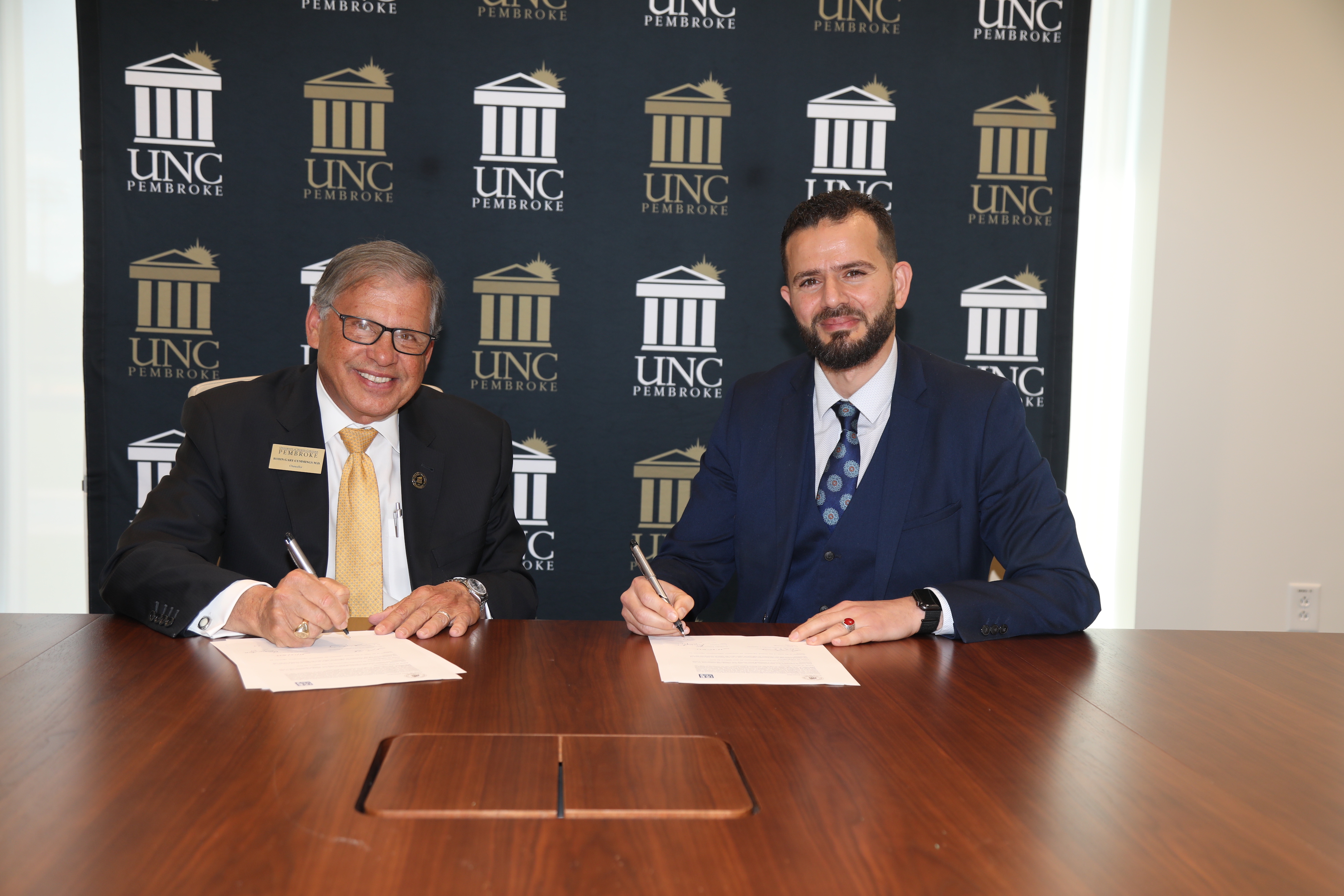 UNCP Chancellor Robin Gary Cummings (left) and Dr. Oussama Ammar, dean of programs at Montpellier Business School, establish an academic partnership during a MOU signing event at UNC Pembroke.