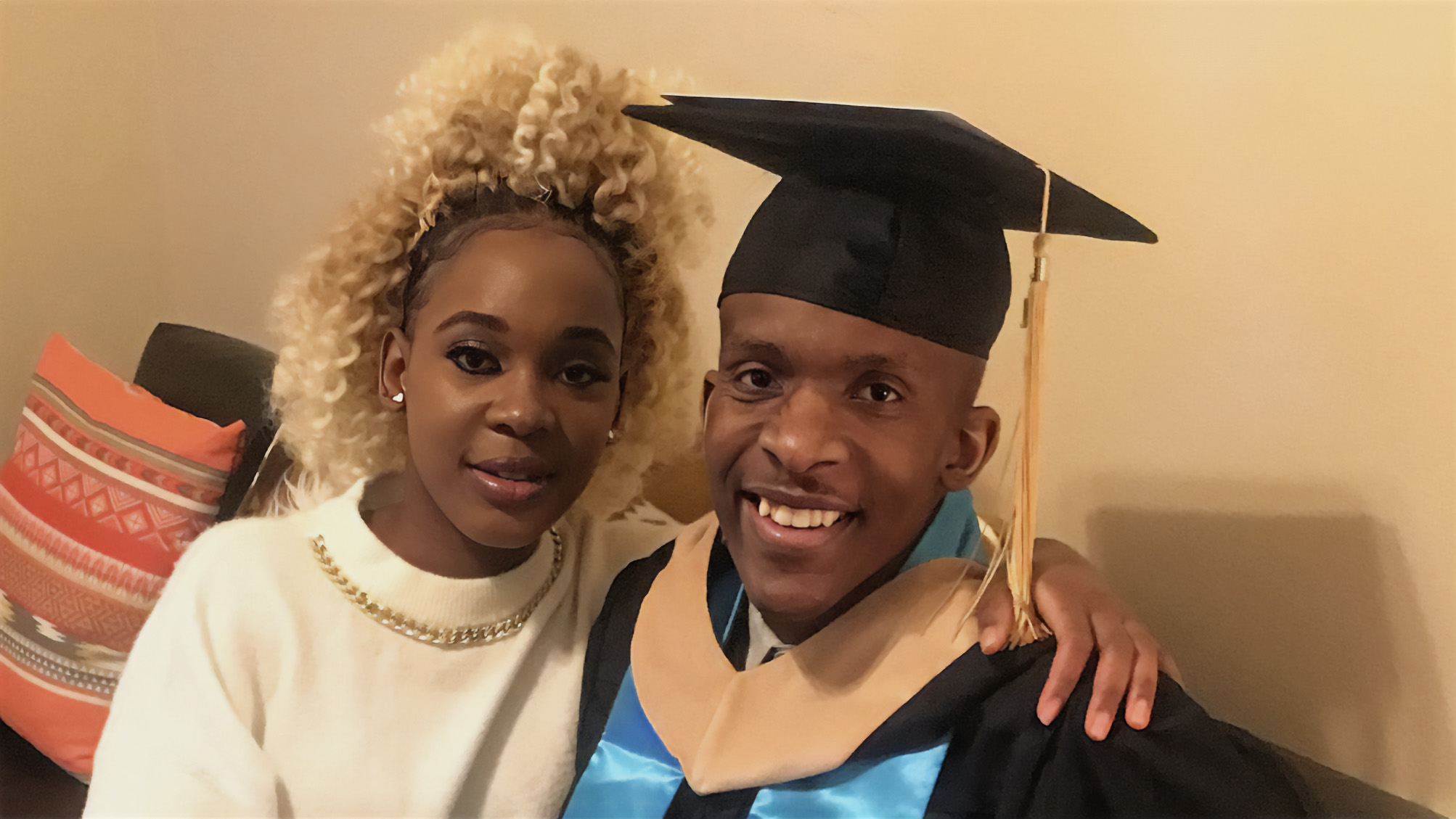 Paula Mukau and her brother, Sam, at his graduation ceremony at UNCP in 2021