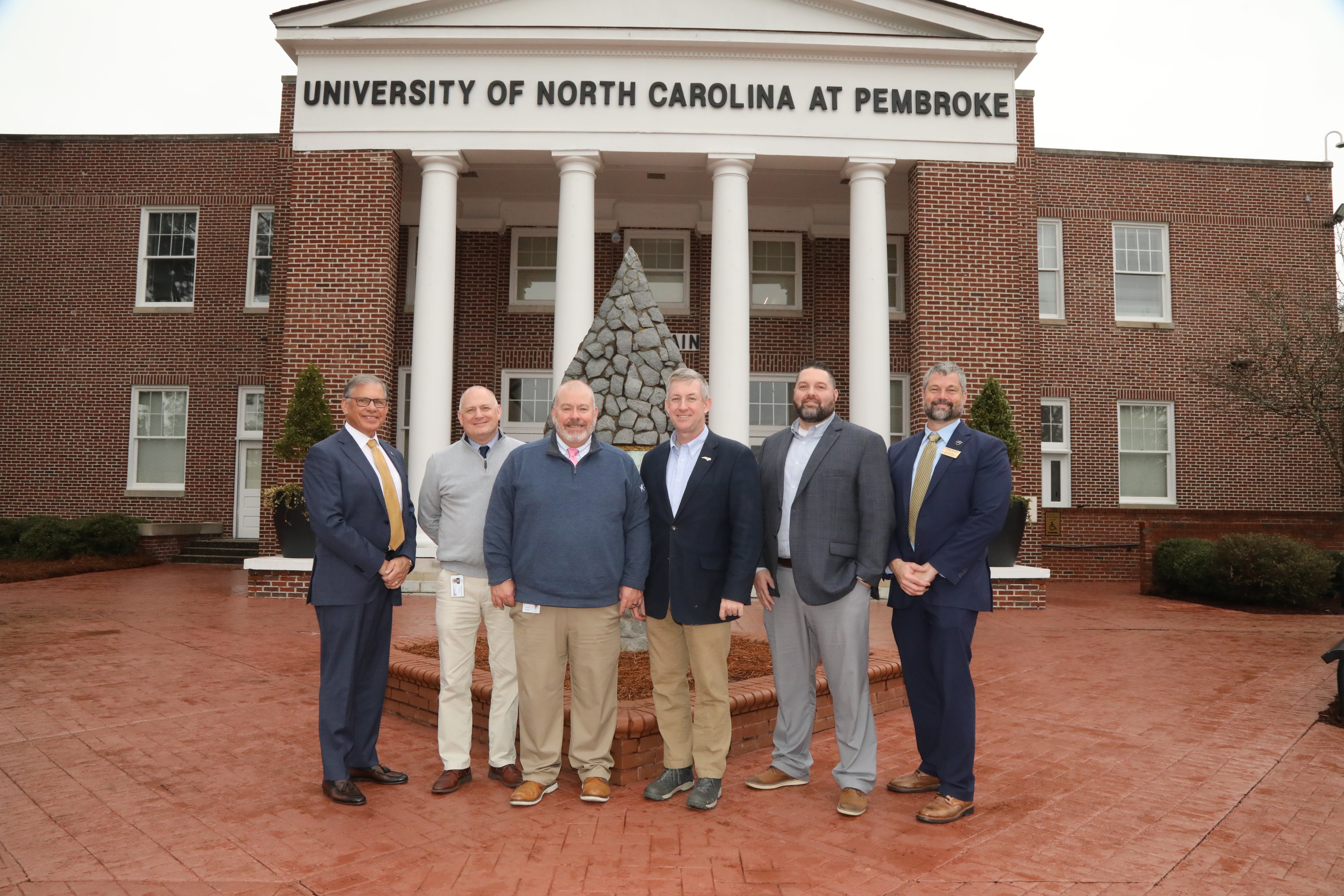 Chancellor Robin Gary Cummings, left, Mike Metcalf, Tim Locklair, President Sandy Stewart, DJ Farmer and Jess Boersma