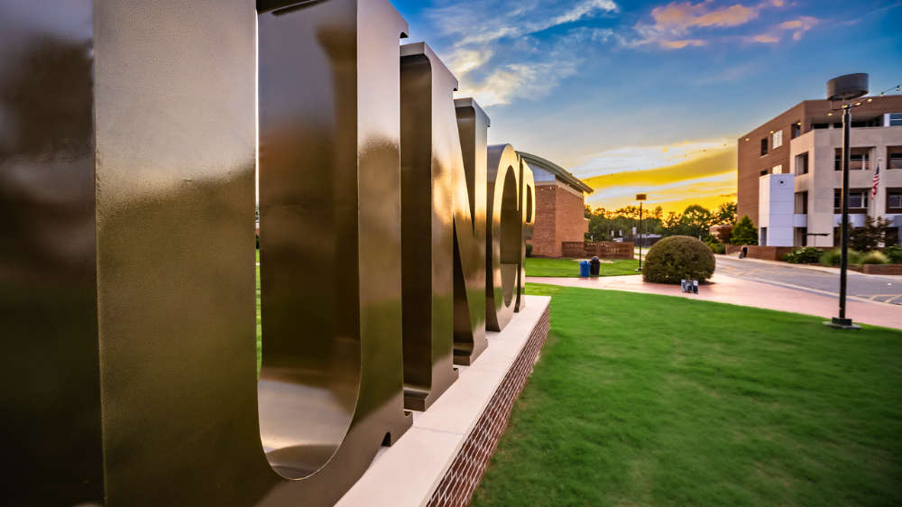 UNCP Letter sign on the main campus at sunset