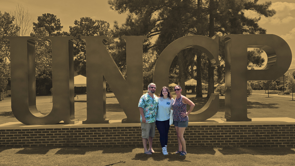 UNCP student veterans Corey and Rita Beal pose with their daughter Cecilia, all three of whom are students at UNC Pembroke, representing the military-connected student community.