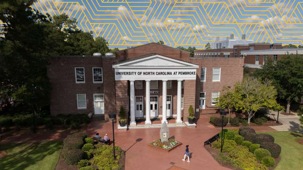 The front facade of Old Main, UNC Pembroke's historic 1923 landmark building, currently undergoing exterior restoration with federal and university funding.