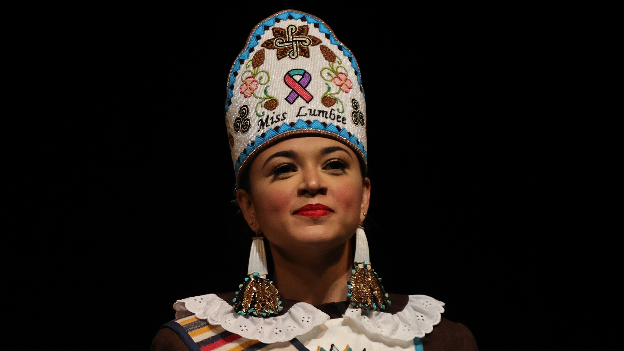 Taylor Davis, Miss Lumbee, speaks during the Lumbee Cultural Showcase.