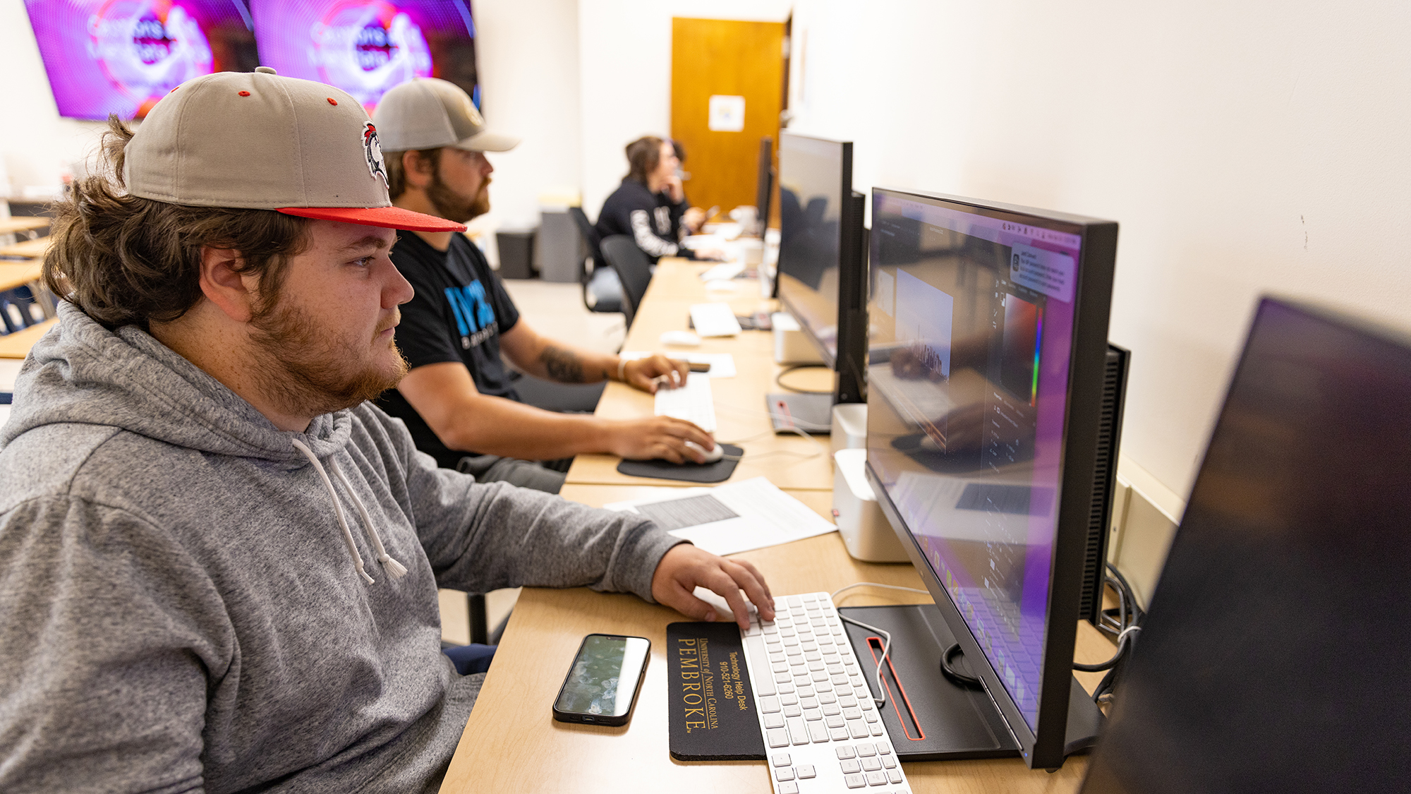 students at computers in newspaper classroom