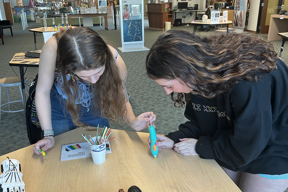 two students working at a desk