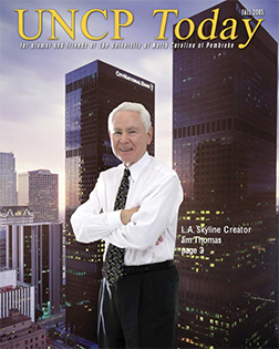 la skyline along with the creator jim thomas from the cover of the UNCP Today fall 2005 edition