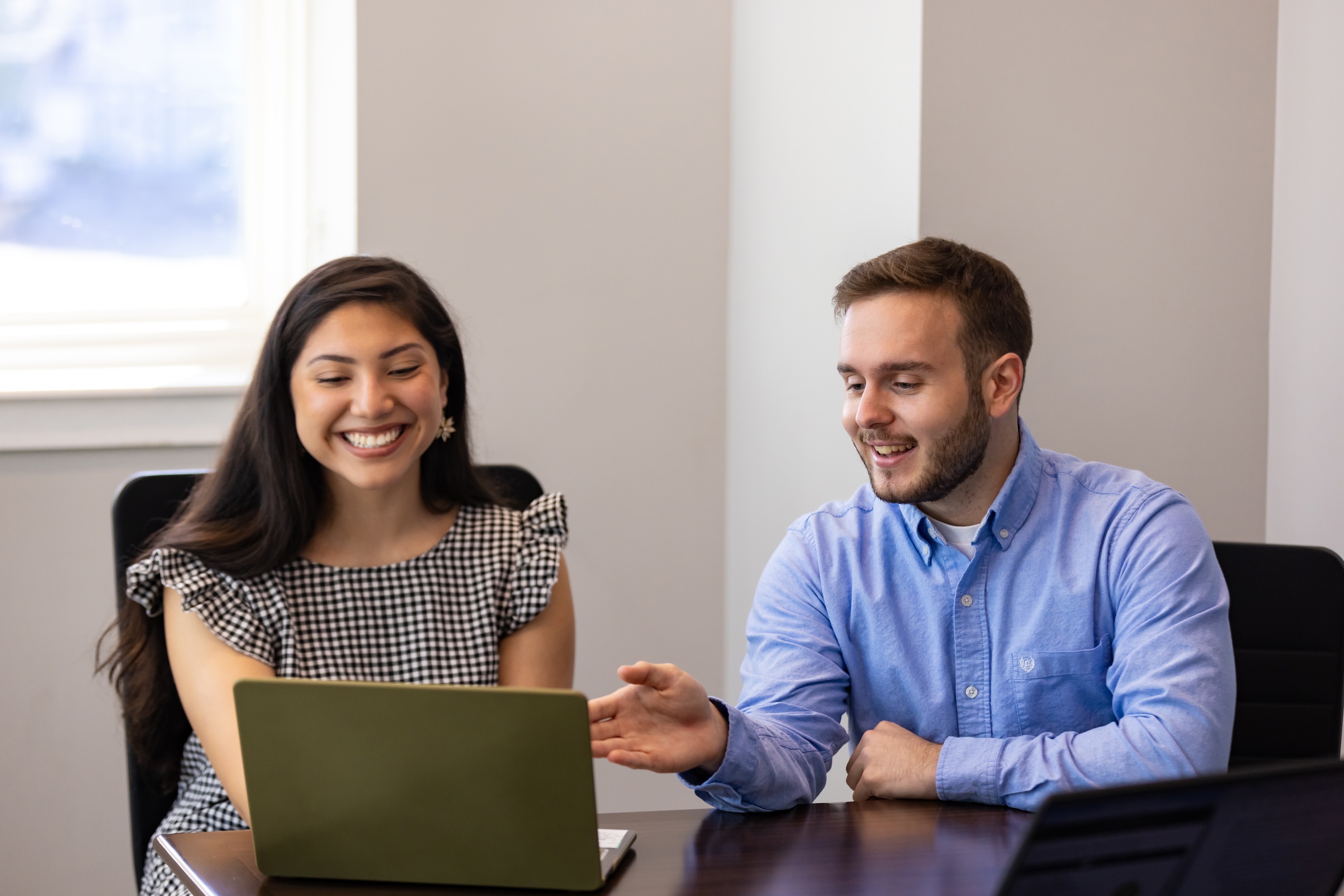 graduate students UNCP Pembroke work on a laptop together