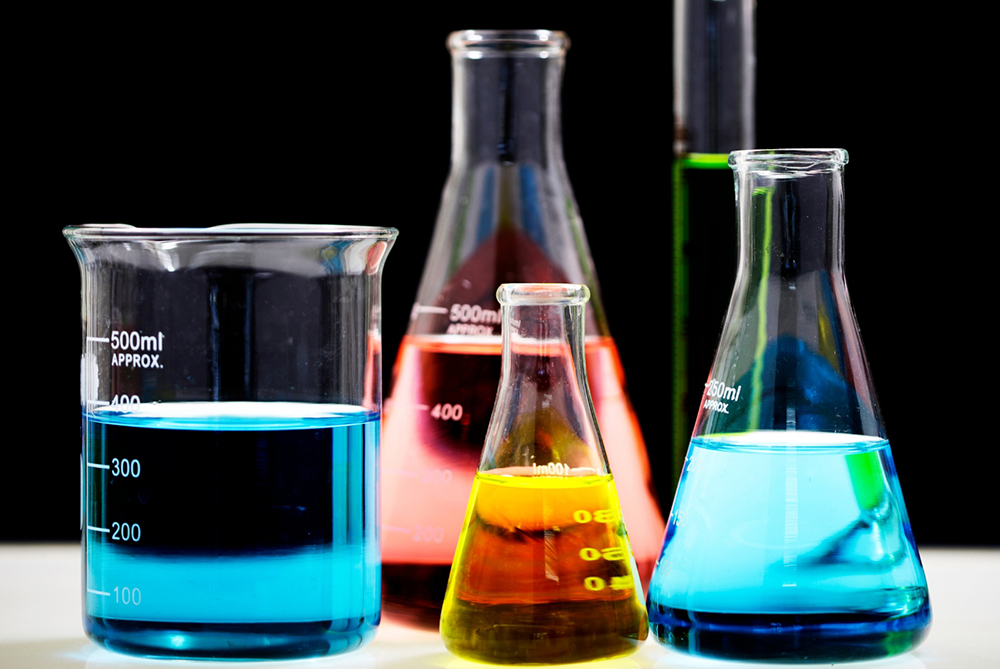 A detailed scene of a chemistry laboratory in action with glassware and chemical experiments, symbolizing UNCP’s robust chemistry program