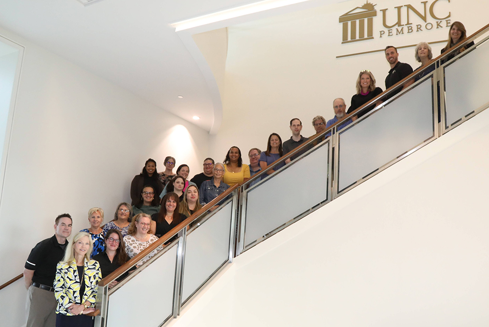 grad council arrayed on a staircase