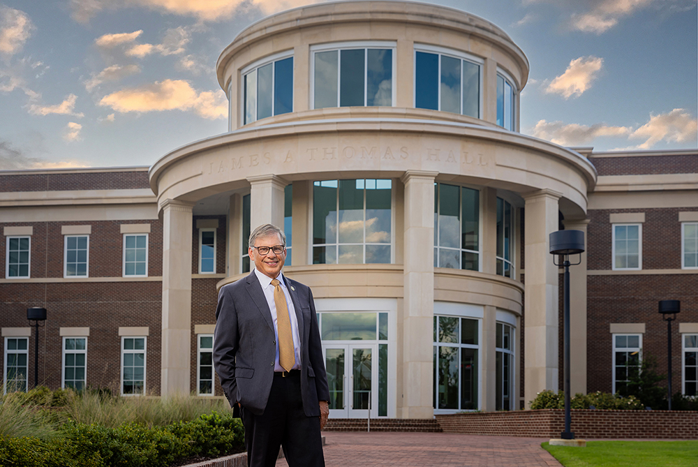 Chancellor Robin G. Cummings in front of James A. Thomas Hall