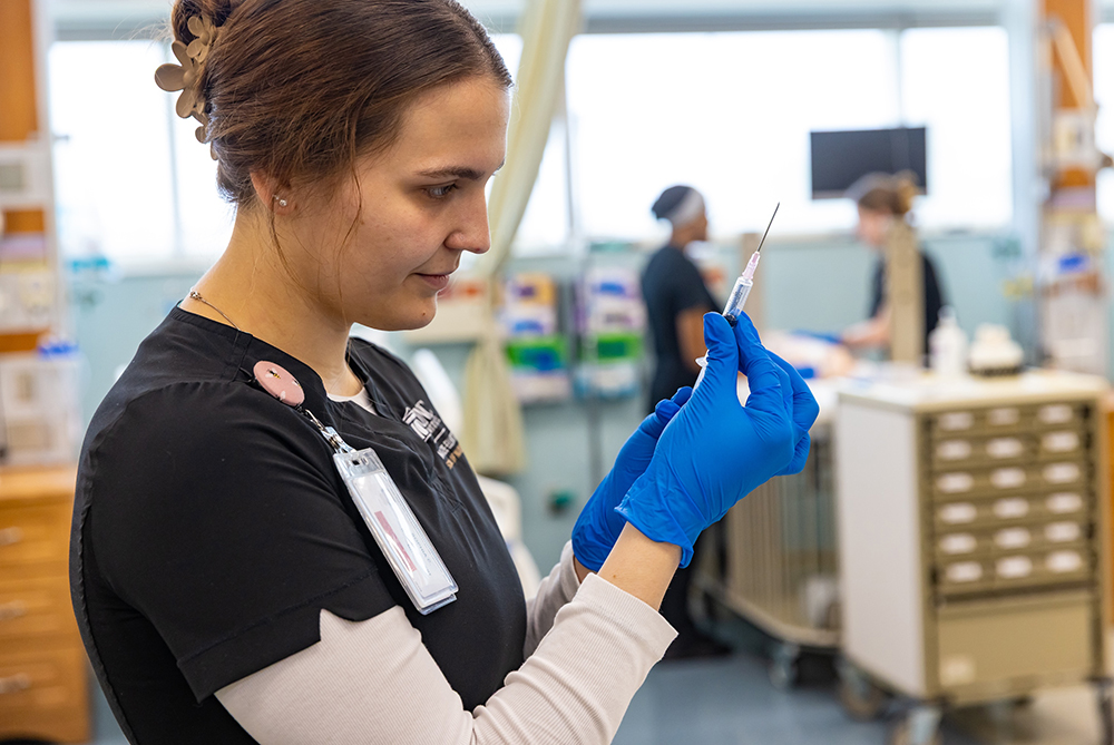UNC Pembroke nursings tudent preparing shot