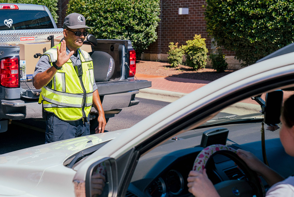 Campus Police directing traffic at move-in