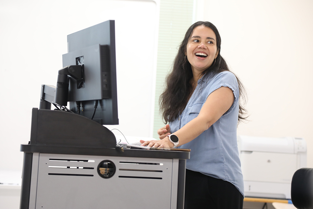UNCP teacher at a computer teaching a class