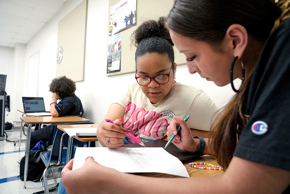 Two UNC Pembroke students at a table for tutoring