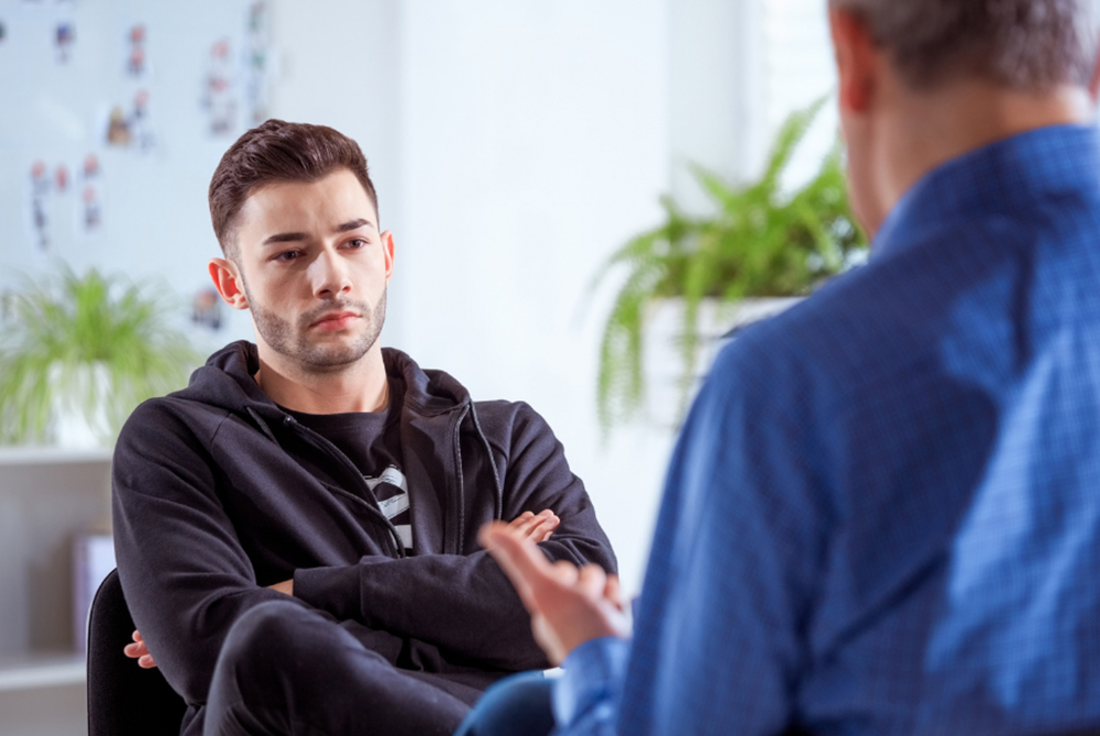 male being counseled and getting support