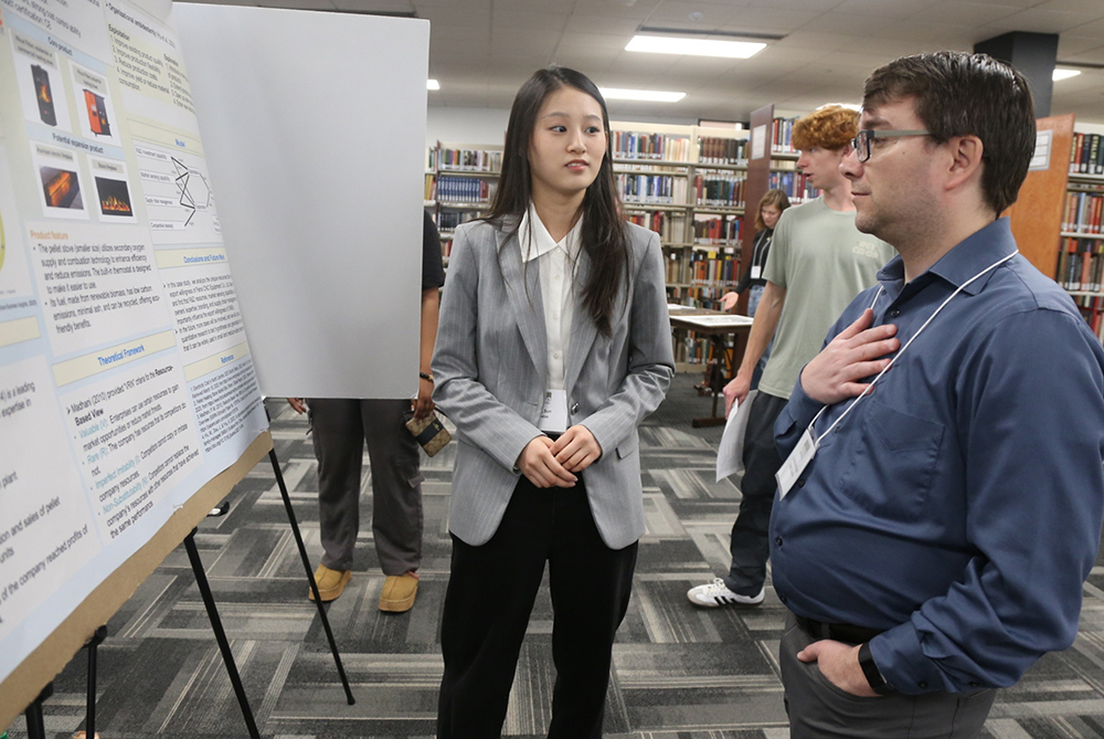 An engaging image symbolizing the PURC initiative at UNCP, depicting collaborative research and community engagement in a modern academic environment.