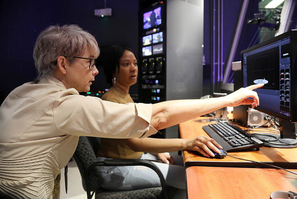 Faculty member working with student