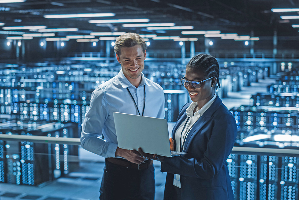 man and woman on laptop technology