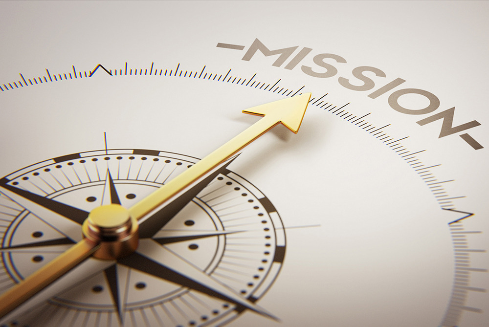 compass with arrow pointing to the word "mission"
