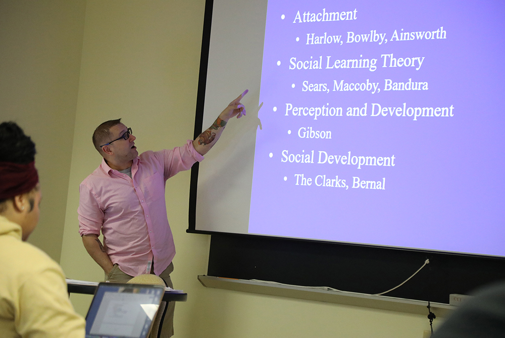 psychology faculty in front of a powerpoint