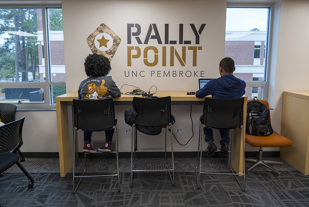 Students filling out applications via computer