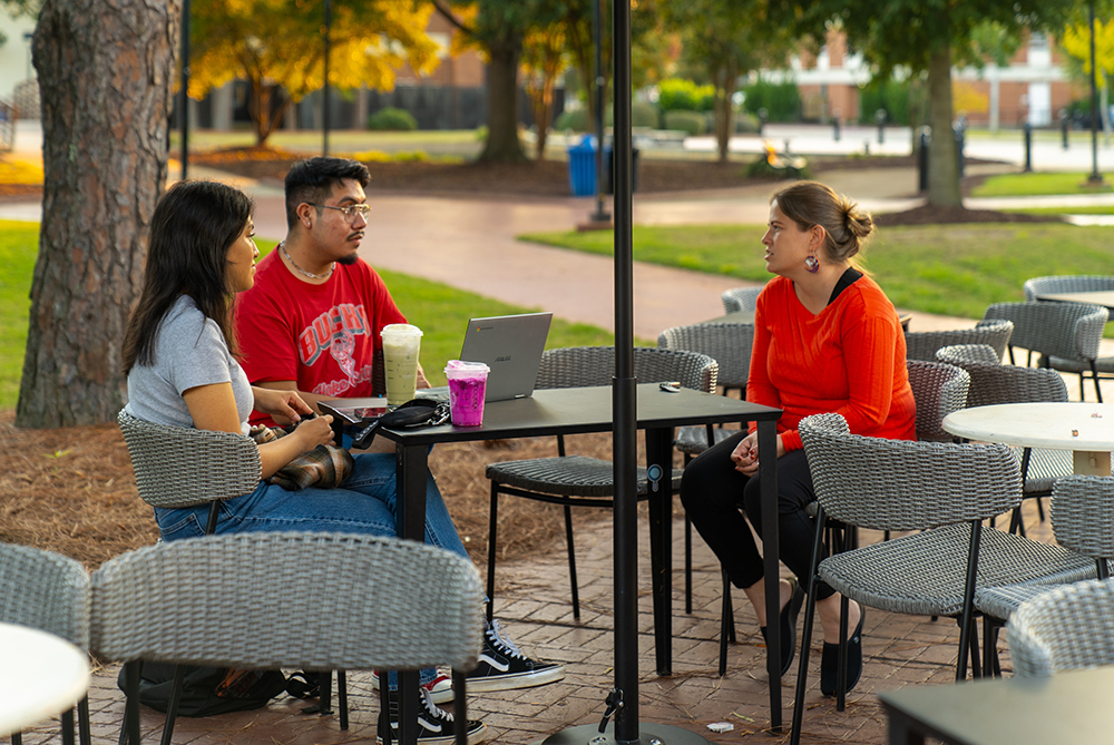 students outside at UNC Pembroke at table