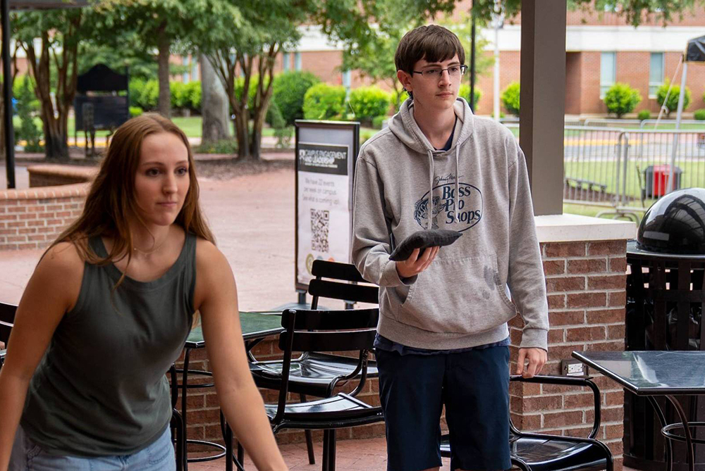UNCP student playing corn hole championship