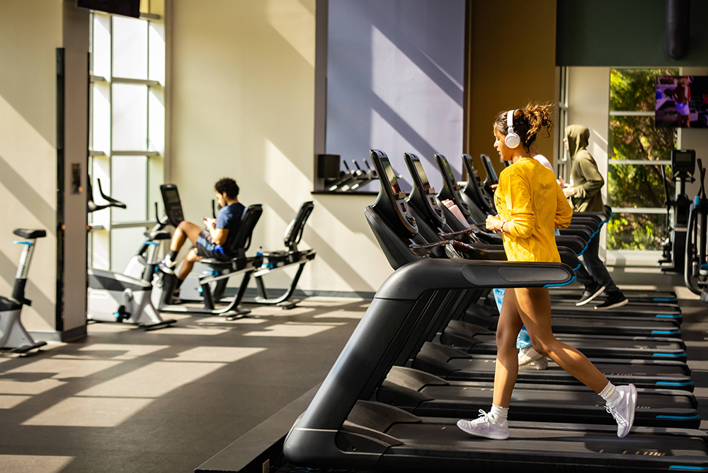 Student running on a treadmill in the Campbell Wellness Center