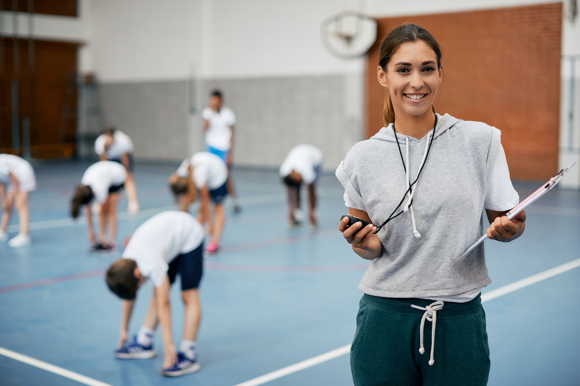 female PE teacher in a class