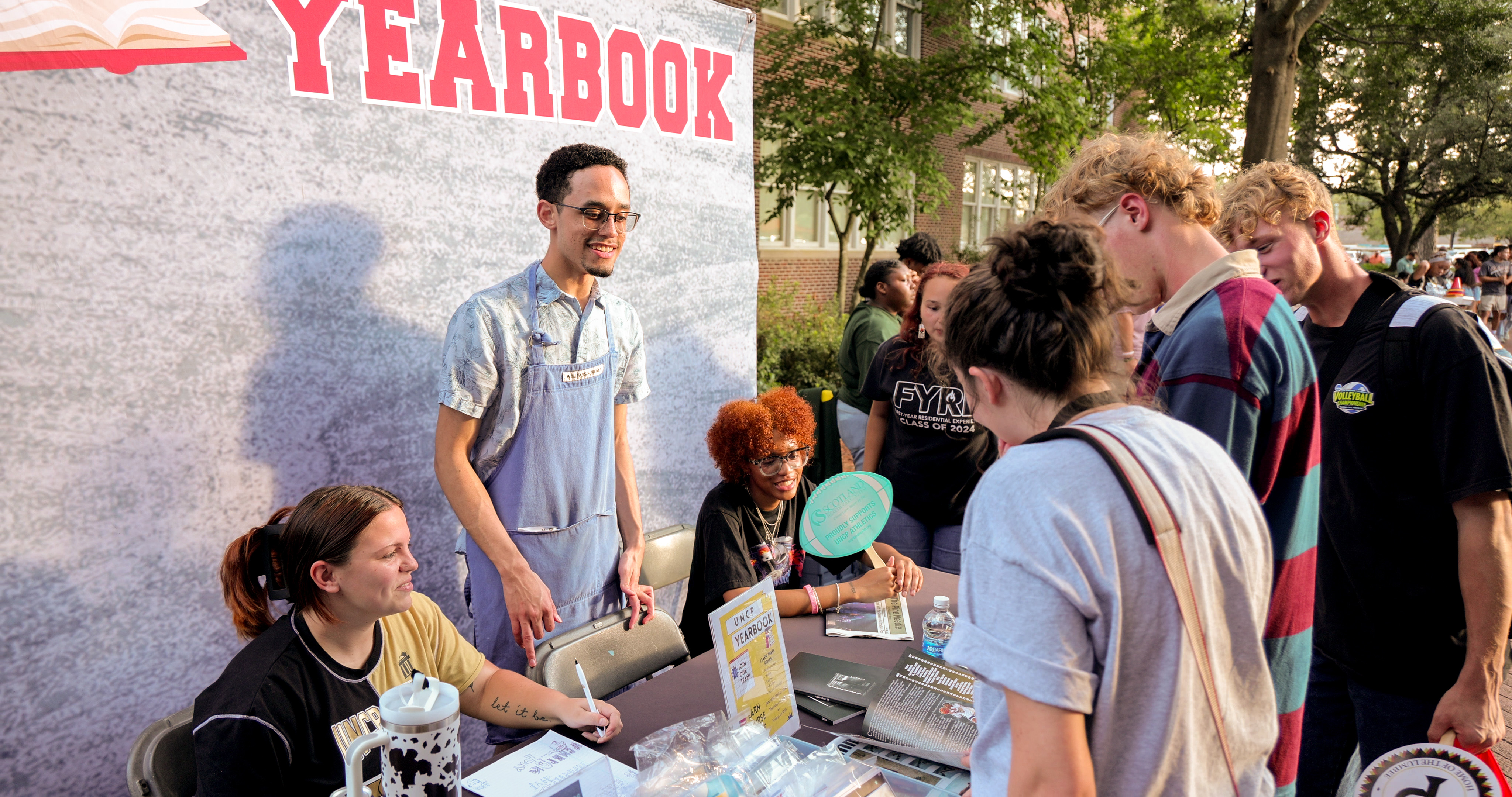 Students at the Yearbook booth on Pembroke Day