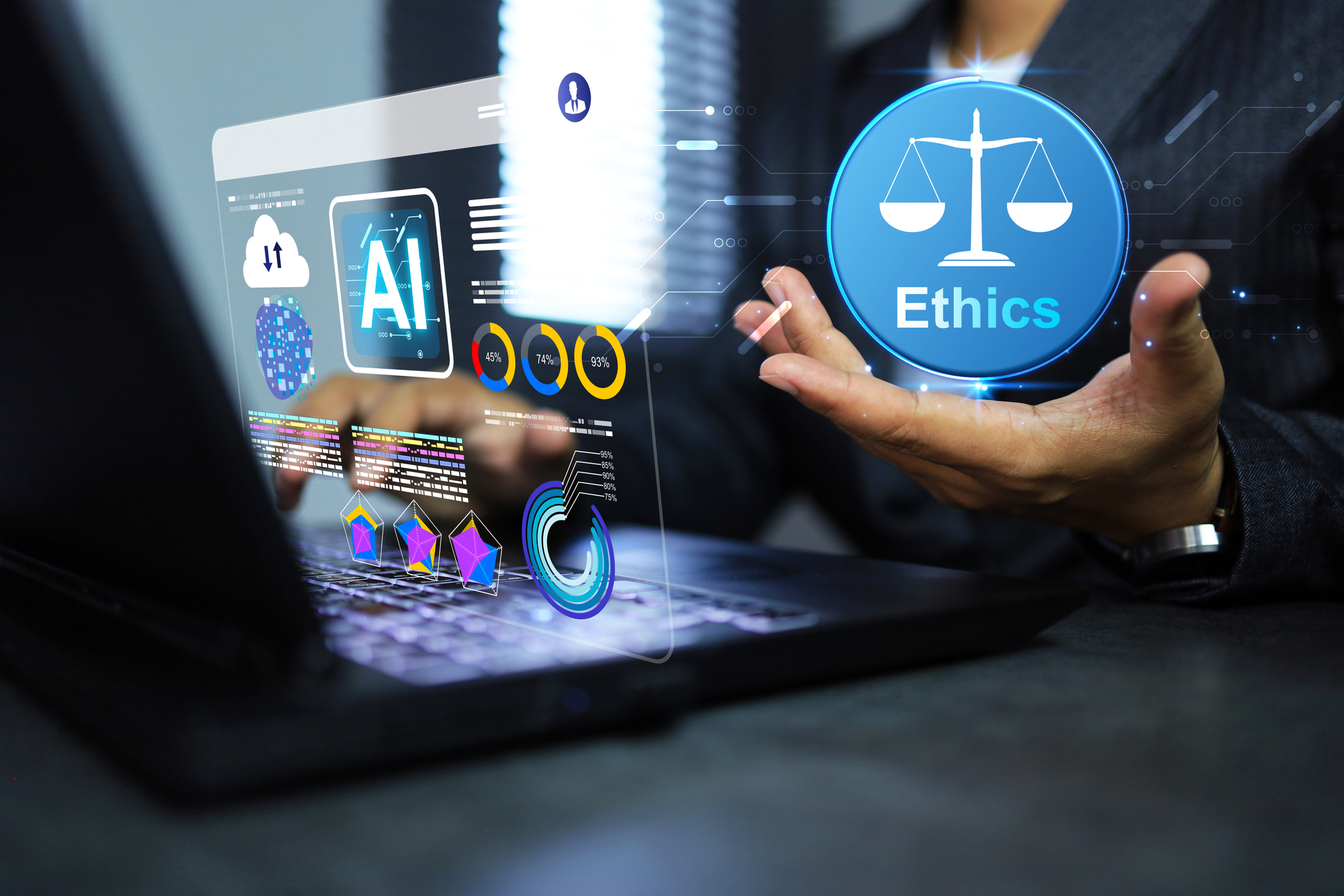 man sitting with computer that has graphics coming out of it. He is pretending to hold an ethics bubble