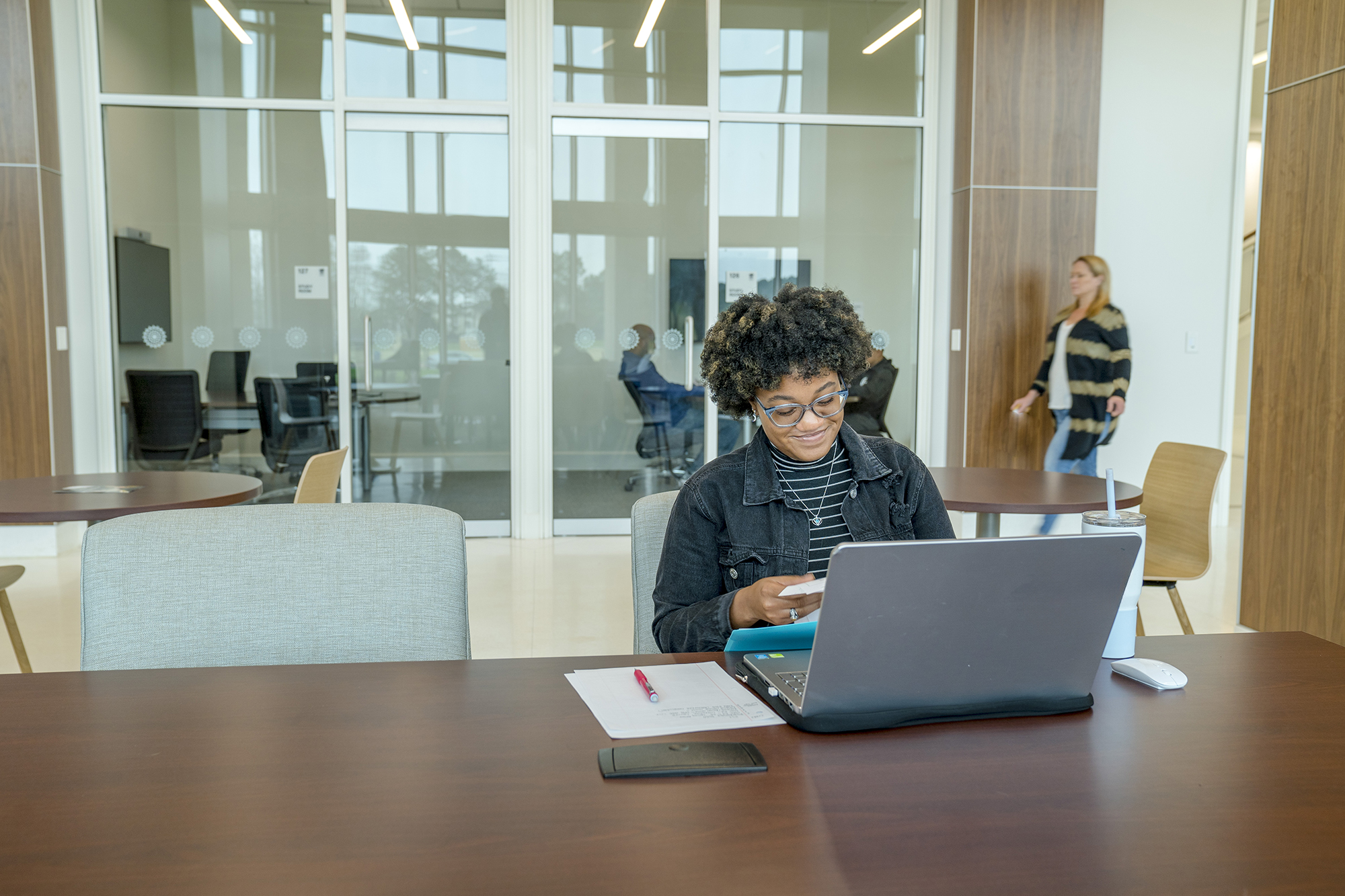UNCP student sitting with laptop studying