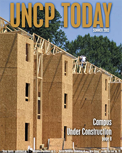 construction site from the cover of the UNCP Today summer 2003 edition