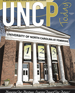 front of the old main building on campus from the cover of the UNCP Today summer 2012 edition