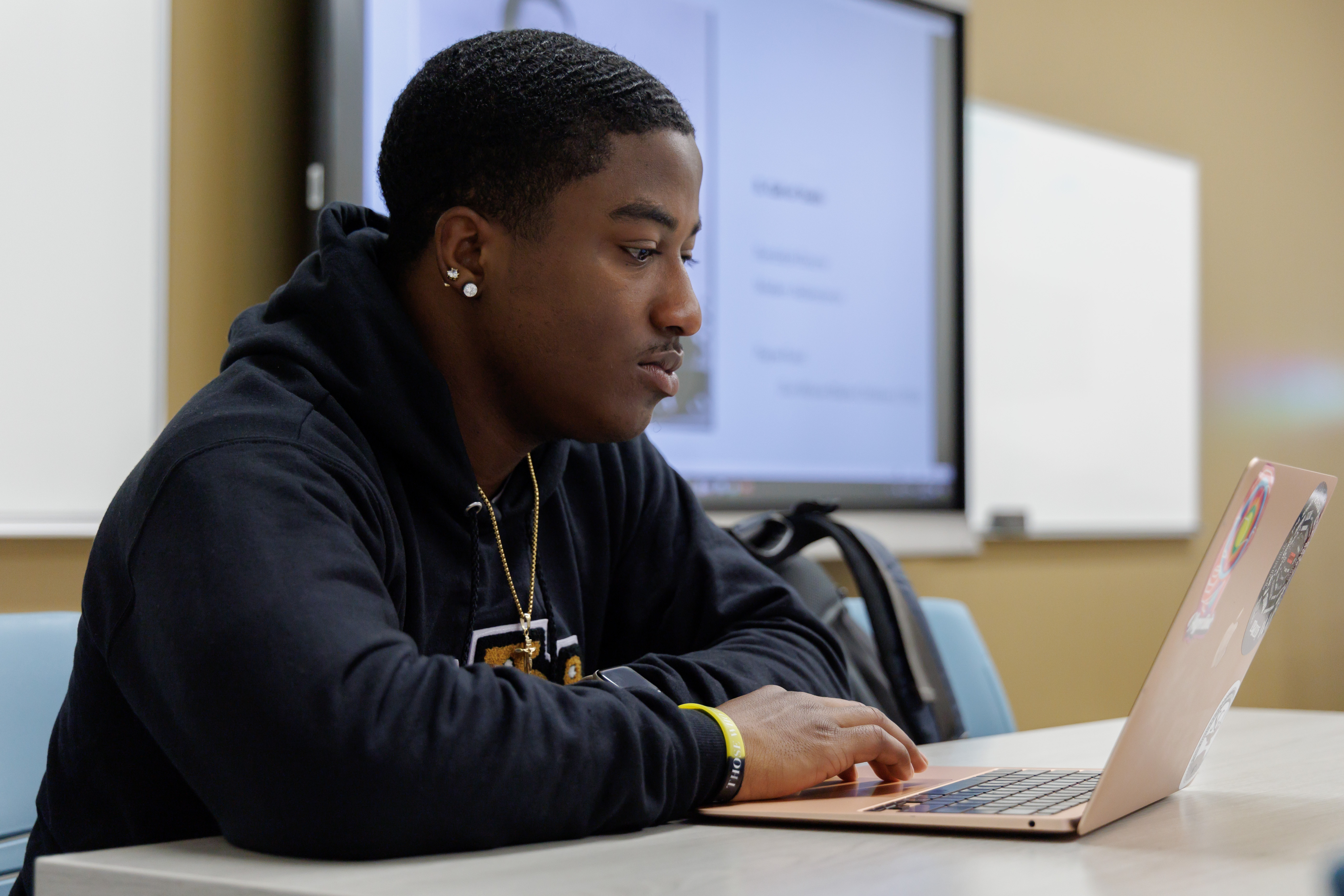 UNCP student on laptop navigating the online parking portal